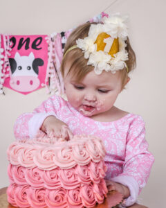 Pink western themed first birthday cake smash 