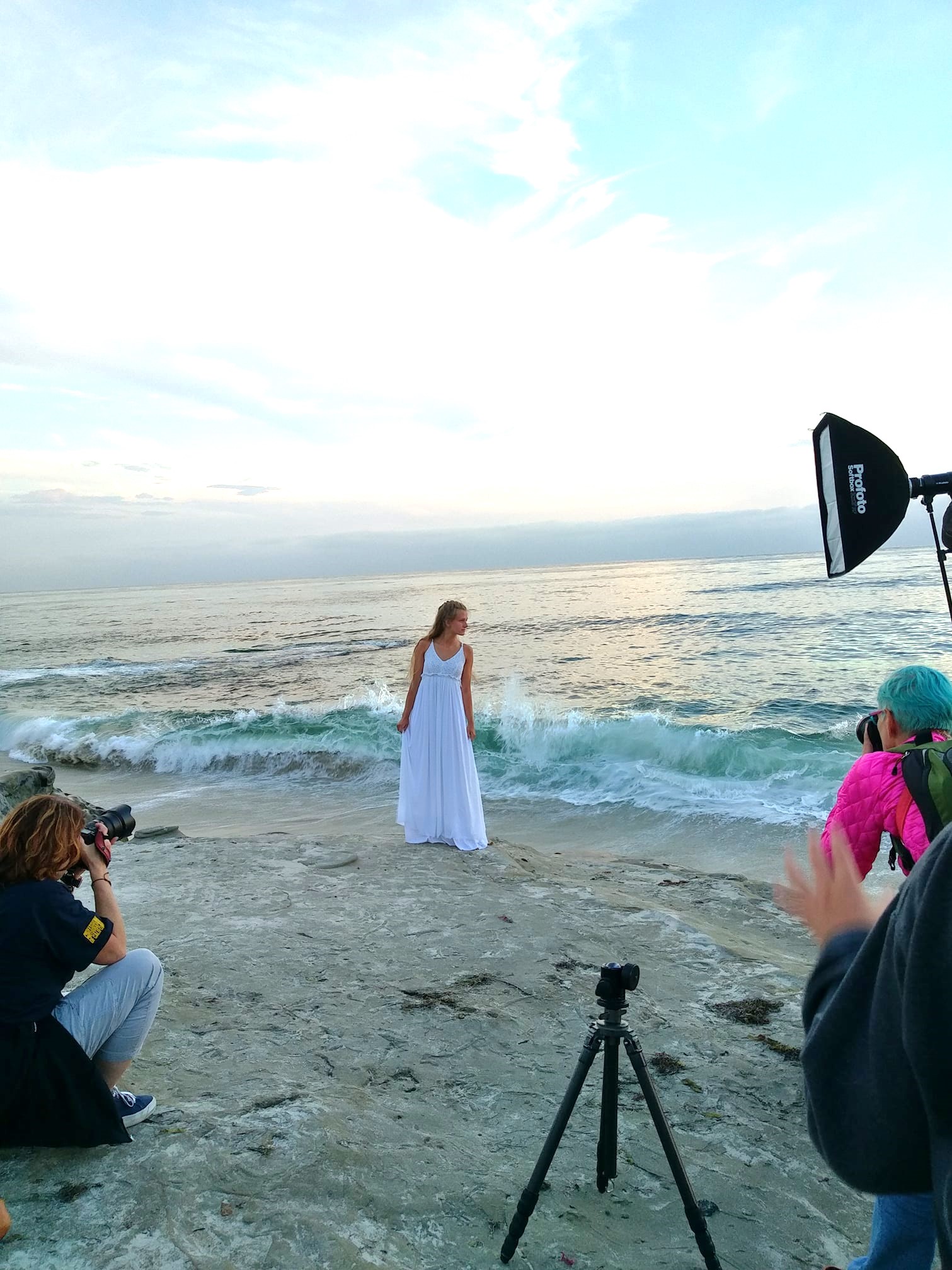 West Coast Schools Photography workshop at the beach with model in white dress.