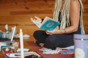 Emilee with her book at Emilees Healing Hut