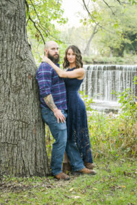 Engaged couple photographed at Beckman Mills near the waterfall.