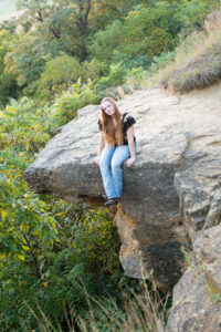 High school senior girl photographed on the bluff at a favorite senior picture location in Evansville.