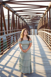 High school senior girl on the iron footbridge in downtown Beloit.