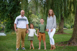 Family of four portraits at a park with Janesville family photographer. 