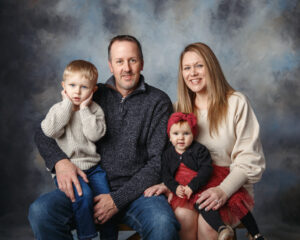 Traditional Family Portraits of a family of four taken at our studio near Janesville WI.