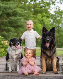 Big brother, little sister and two big dogs.