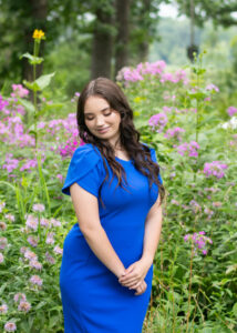 Senior Portrait of a pretty girl in a blue dress. 