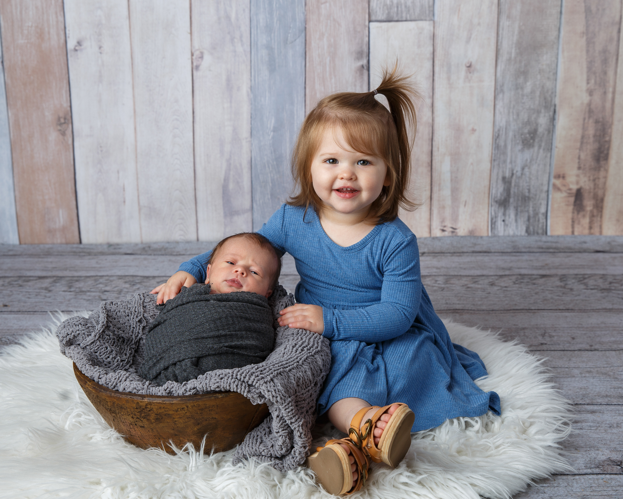 Big sister with newborn baby photographed by newborn photographer at Life in Pink Photography.