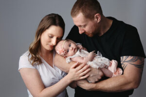 Lifestyle image of new parents with their newborn baby