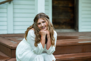 Cute senior picture photographed on the porch of Beckman mill building in Beloit.  