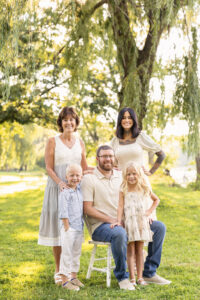 Family Portrait of Mom, Dad, kids and grandmother taken by the willow trees at Riverside Park in Janesville.
